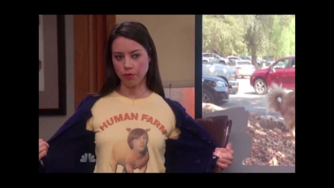 A woman wearing a yellow t-shirt with a graphic of a sheep and the text "HUMAN FARM" is shown in the image.