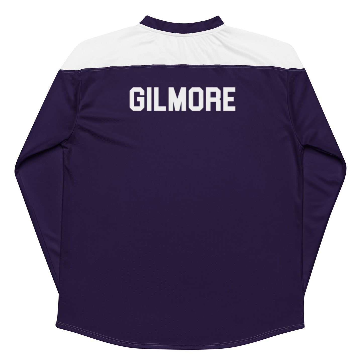 The back of a retro recycled hockey jersey in purple and white that says "GILMORE" on the back from the movie "Happy Gilmore 2" worn by Adam Sandler in a tribute to hockey player Johnny Gaudreau.