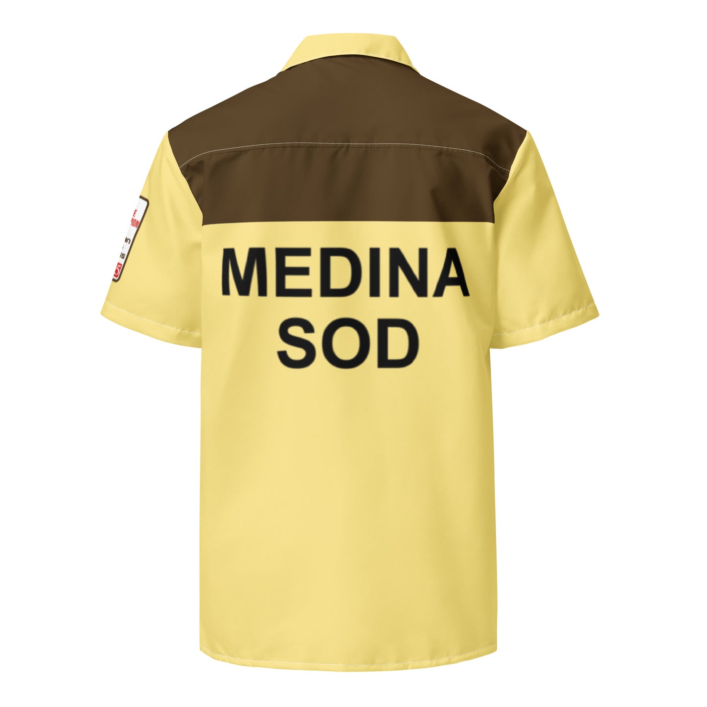 A retro, collared yellow and brown button down shirt, the back of which says "Medina Sod", in reference to the bowling shirt that Jeffrey Lebowski, also known as "The Dude", played by actor Jeff Bridges. References the 1998 crime comedy film "The Big Lebowski" and serves as a costume shirt.