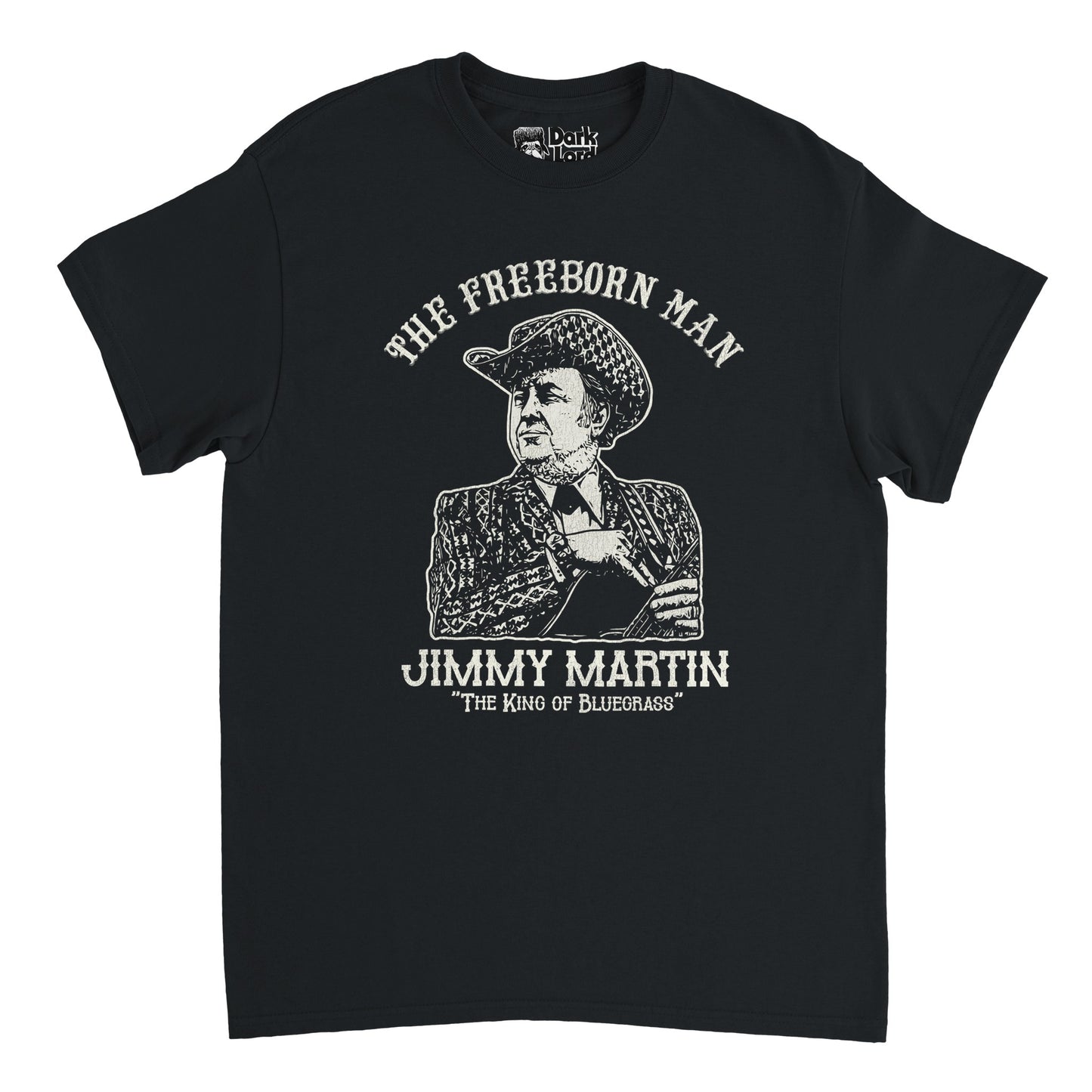 A retro, 70s style black colored t-shirt that says "The Freeborn Man," referencing the 1969 album, above an image of the world famous American singer and musician Jimmy Martin, known as "The King of Bluegrass", wearing a checkered cowboy hat and patterned suit and tie, holding his guitar.