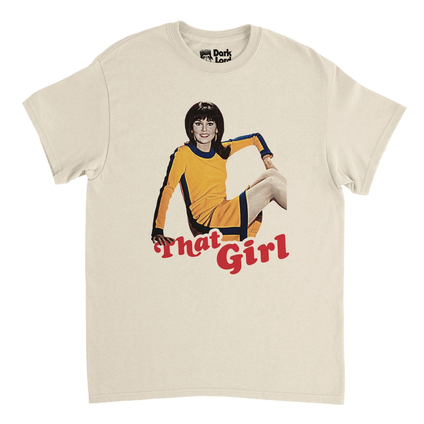 A soft cream colored, 70s style vintage offwhite t-shirt with the words "That Girl" in red underneath the image of iconic actress Marlo Thomas in an iconic navy and yellow dress, her hair in a classic flip hairstyle famous from the 1960s. References the iconic TV sitcom comedy show 'That Girl' which focused on main character Ann Marie (played by Marie Thomas) and ran in from the 60s-70s.
