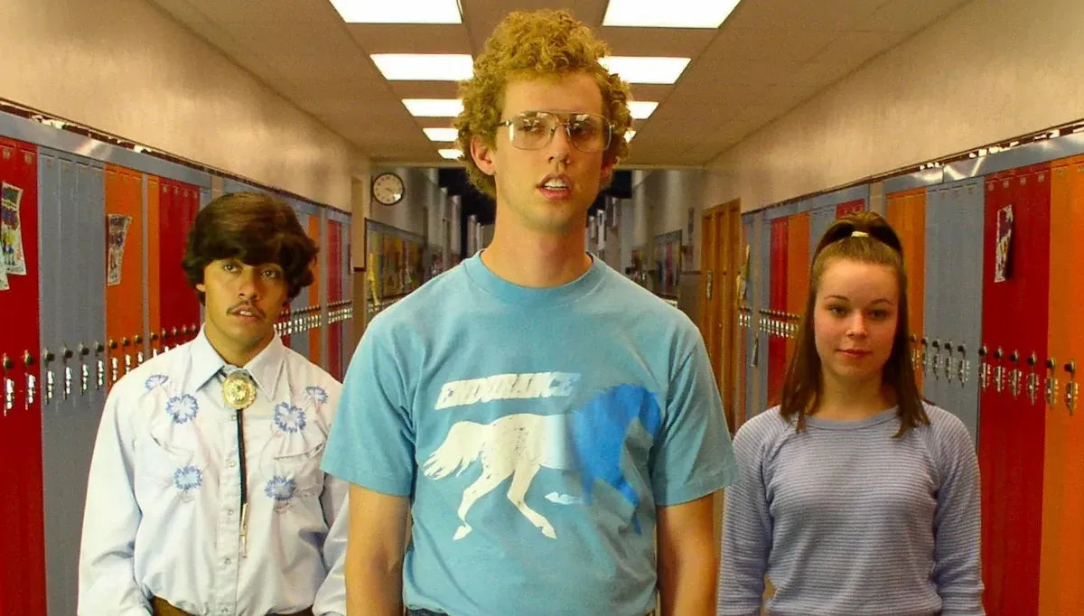 a group of people standing next to each other in a hallway