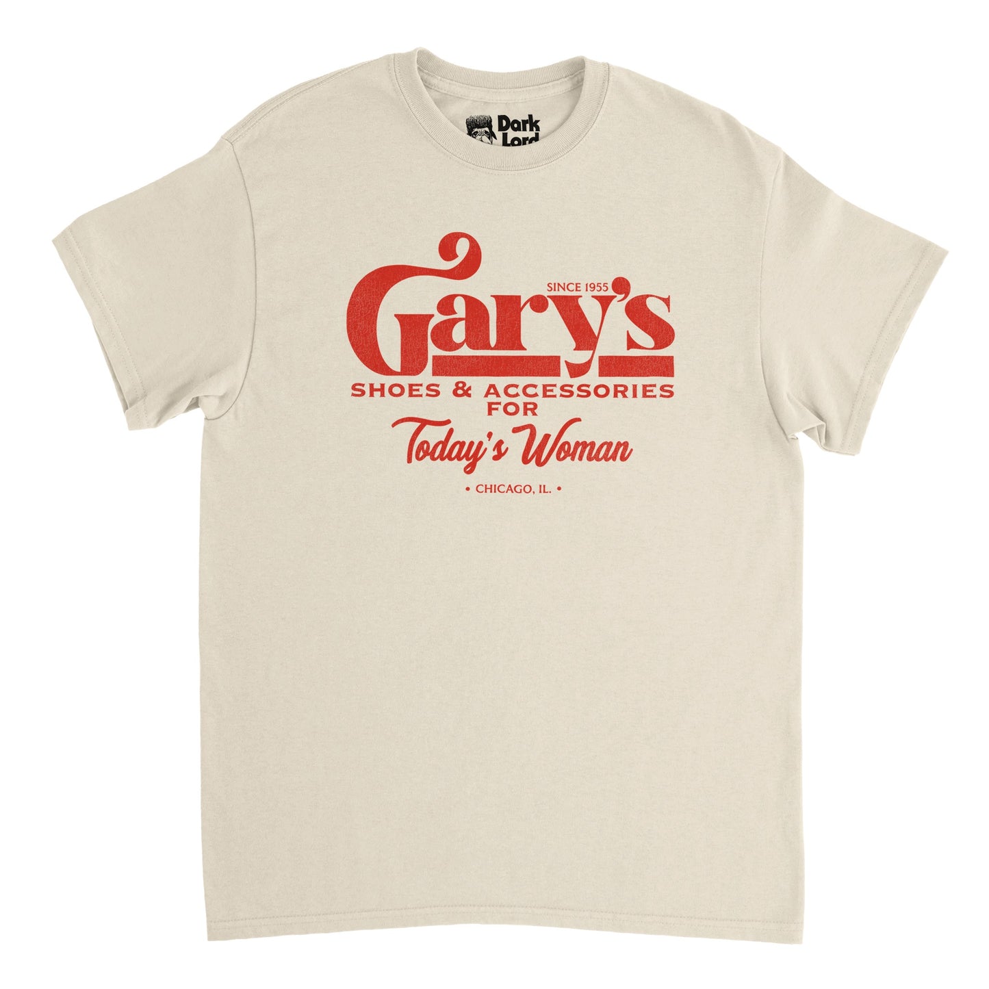 A soft cream colored vintage, 80s style t-shirt that says "Gary's Shoes & Accessories For Today's Woman" in red text along with location "Chicago, IL" and "Since 1955", in reference to the sitcom television series "Married... with Children" in which Al Bundy and Griff work for Gary at her shop.