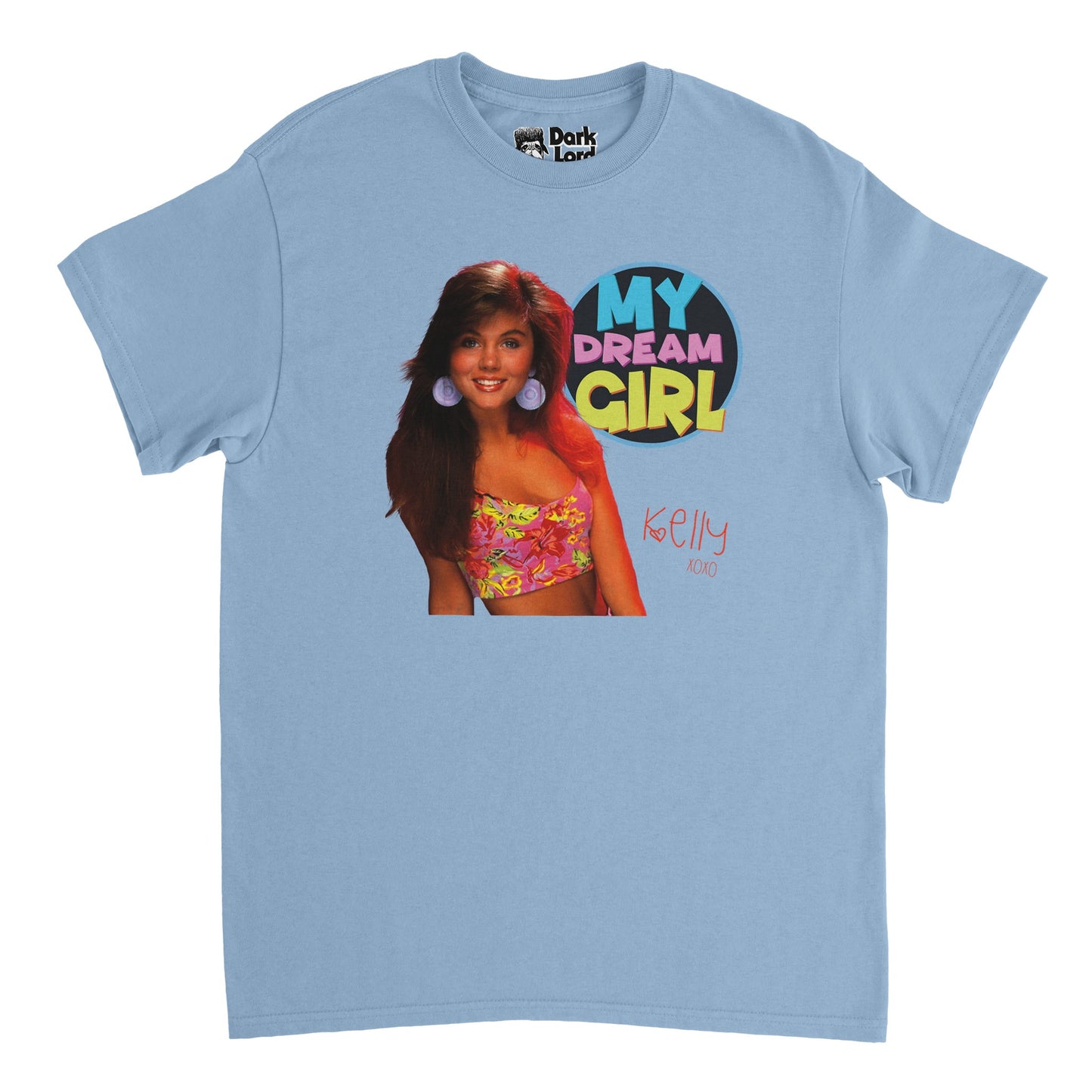 A retro, 80s style t-shirt in light blue that says "My Dream Girl" in bold, colorful letters and "Kelly XOXO" with a small heart by the "K". Includes an image of Kelly Kapowski, played by Tiffani Amber Thiessen, a character from the famous 1989 TV show Saved by the Bell, and references the saying 'Kelly Kapowski is my dream girl'.