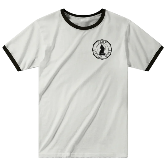 A white t-shirt with a black graphic design on the left side, depicting a silhouette of a wolf.