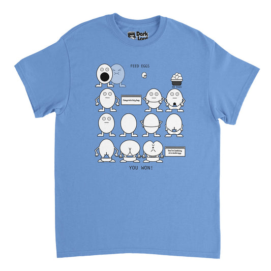 A vintage, 70s style carolina blue colored t-shirt. Shirt says "40 eggs" under the image of a basket of eggs to be eaten, "Feed Eggs" above an open mouthed egg, waiting to be fed, "Congrats big boy" next to an egg with its pants down, and "You're looking at a nude egg" next to an egg with its butt showing, and "You Won!" at the bottom. References the iconic 'Eggman Game' from the comedy television sketch "I Think You Should Leave with Tim Robinson" created by Time Robinson and Zach Kanin. 